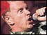 Johnny Rotten grabbing a microphone and singing