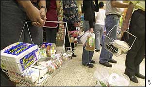 Venezuelans queue in supermarket