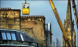Workmen in crane basket