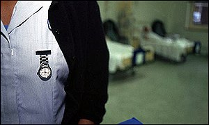 Photograph of a nurse on a ward 