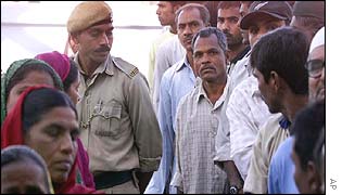 Voters queue in the predominantly Muslim neighbourhood of Naroda Patiya