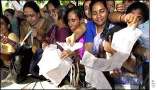 Election staff collecting duty material from officials.