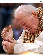 Pope John Paul II prays in Rome