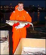 Fisherman holds cod Alex Kirby