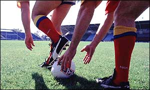 Rugby ball about to be kicked