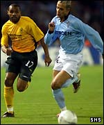 Saeni goes past Celtic's Didier Agathe