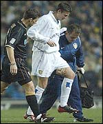 Michael Bridges is helped off the field