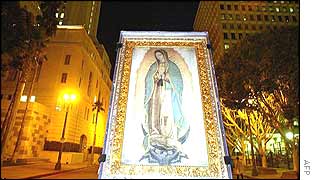 Replica of an icon of the Virgin of Guadalupe is carried in Los Angeles