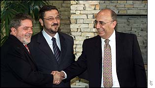 Brazilian President-elect Luiz Inacio Lula da Silva, finance minister elect Antonio Palocci, and Henrique de Campos Meirelles,