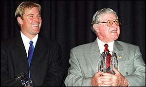Shane Warne shares a joke with Neil Harvey