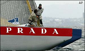Bowmen Paolo Bassani of Prada and Alan Smith of OneWorld stare at each other in mid-race