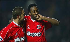 Jason Euell celebrates scoring the opening goal against Man Cityu