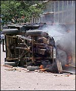 An overturned truck burns in Madagascar