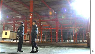 Guards in the empty Sangatte building