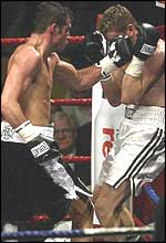 Joe Calzaghe (left) lands a left hand on Tocker Pudwill