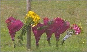 Flowers by the roadside after an accident