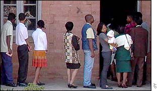 Voters queue outside a polling station in Antananarivo