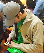 Teenager using mobile phone
