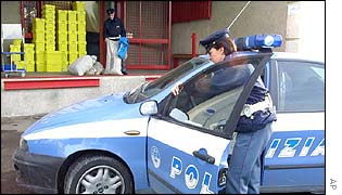 Italian police inspect post bags at the post office in Fiumicino, near Rome