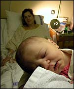 Baby and woman in maternity unit