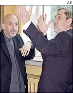 President Karzai (L) with Norway's Foreign Minister Jan Petersen in Oslo