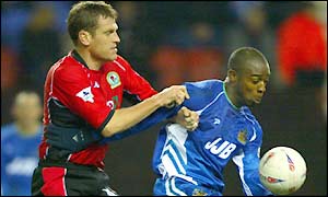 Blackburn's Craig Short tussles with Wigan's Nathan Ellington