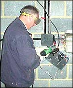 Radiocommunications Agency officer disconnecting a pirate transmitter