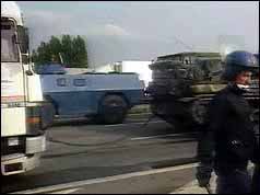Photograph of French riot police and the blockaded A1 motorway