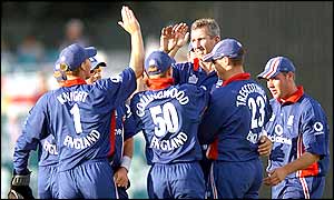 England bowler Andy Caddick is congratulated after taking the wicket of Sri Lankan captain Sanath Jayasuriya