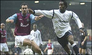Jay Jay Okocha of Bolton bursts past West Ham's Christian Dailly