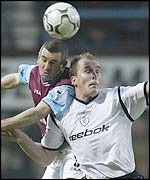 West Ham's Nigel Winterburn and Bolton's Henrik Pedersen