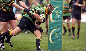 Northampton Saints player Bruce Reihana bursts through for a try 