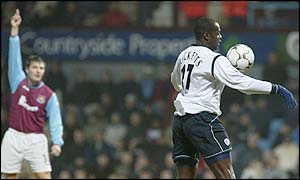 Michel Ricketts of Bolton scores a disputed equaliser 