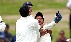 India celebrate as Parthiv Patel takes the wicket of Nathan Astle