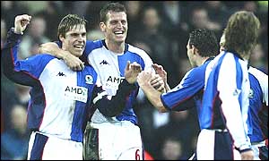 Blackburn players celebrate with goalscorer Garry Flitcroft