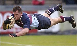 Rotherham's Mike Schmid scores a try