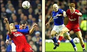 David Weir holds on to Milan Baros while David Weir holds off John Arne Riise
