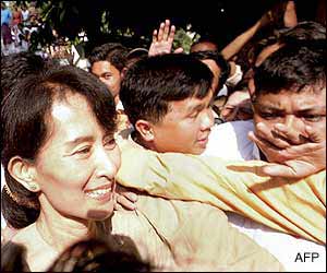 Burmese democracy leader Aung San Suu Kyi makes her way through a large crowd of supporters and well-wishers after being freed from 19 months under house arrest 6 May 2002.