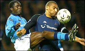 Man City's Marc-Vivien Foe puts in a high challenge on Dean Richards of Spurs