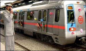 Metro official flags off a gleaming new train