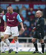 Repka walks after his red card