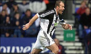 Newcastle's Alan Shearer gets ahead of Bolton's Anthony Barness to score