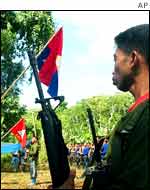Communist New Peoples Army rebels mark the 24th anniversary of the founding of the Philippine Communist Party