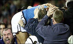 Ali Benarbia celebrates with the Man City fans after scoring 