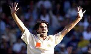 Jason Gillespie celebrates the wicket of Mark Butcher as England struggle towards 97-3 