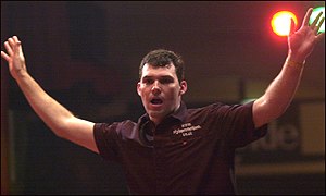 Australia's Tony David raises his arms in triumph in 2002