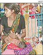 Mother with babies in Indian hospital