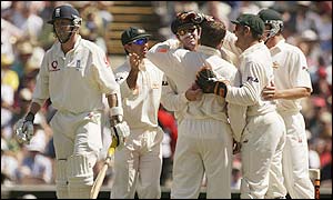 Australia's players celebrate the dismissal of England night-watchman Richard Dawson