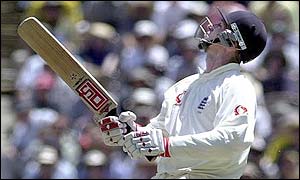 John Crawley look sto the sky after mistiming a pull shot to Justin Langer