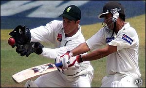 Pakistan batsman Younis Khan misses a stroke as South African wicketkeeper Mark Boucher takes a catch to dismiss him